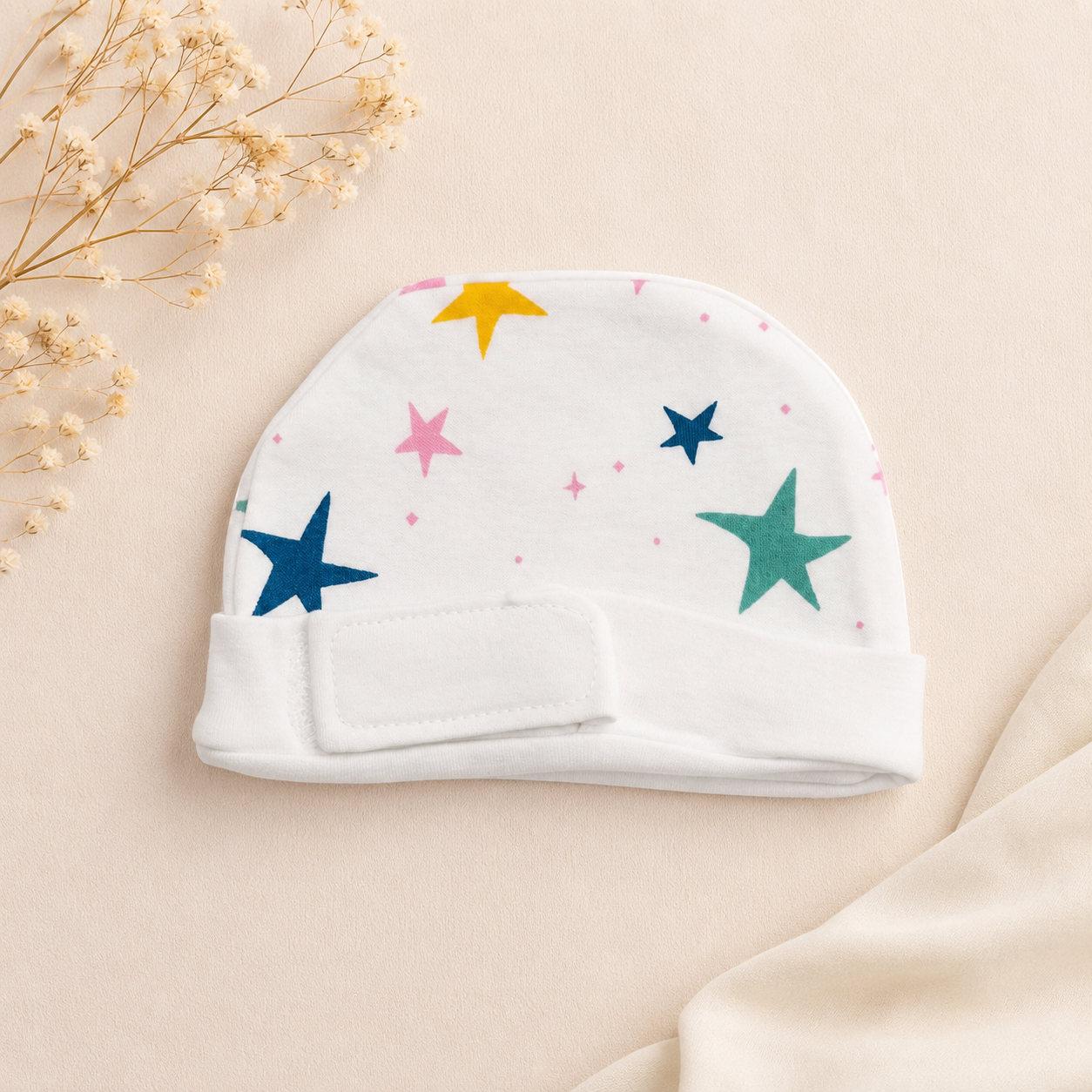 White star-print preemie/NICU cap, front view