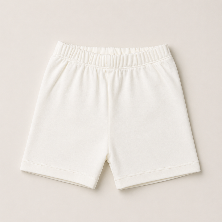 Cream cotton baby shorts with an elasticated waist