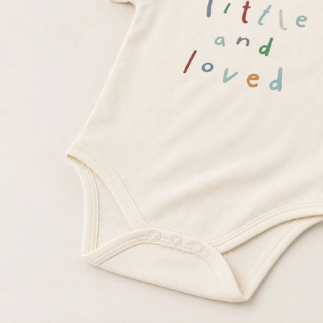 Little and Love | Baby Basic Bodysuit | snap closure detail