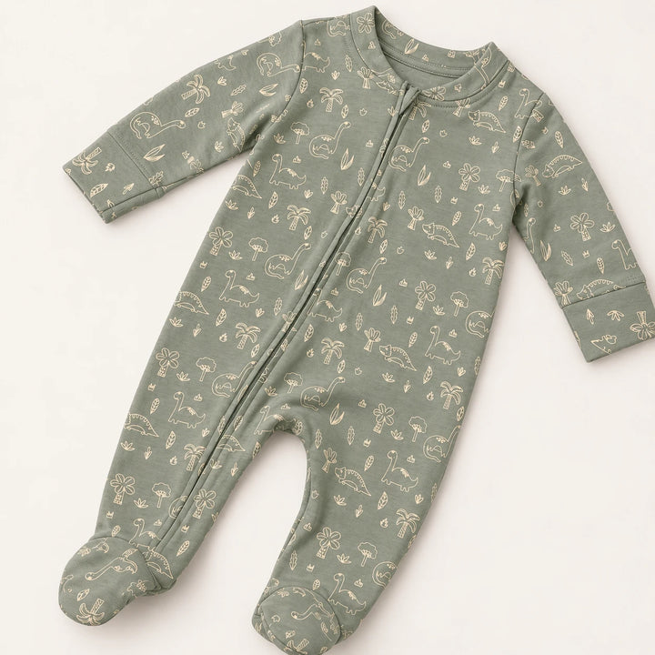 Little Dino | ZB green dinosaur-print footed zipper romper, angled view