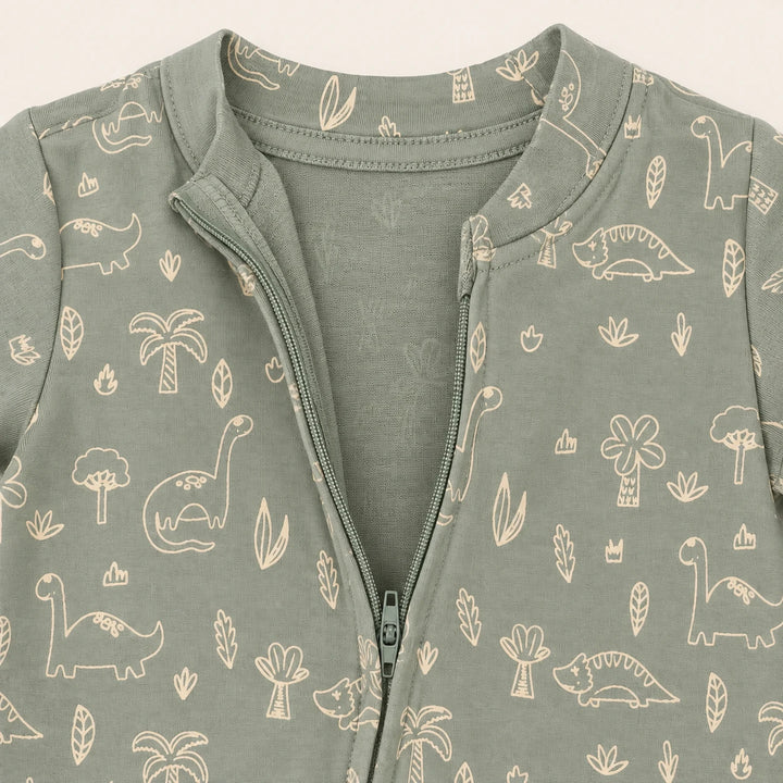 Little Dino | ZB green dinosaur-print footed zipper romper, neckline and zipper detail