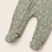 Little Dino | ZB green dinosaur-print footed zipper romper, enclosed feet detail