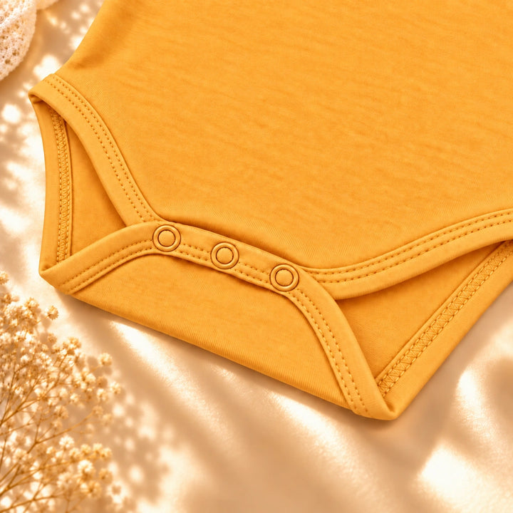 Citrus | ZB Sleeveless Lace Bodysuit – three snaps detail angle luxury gold